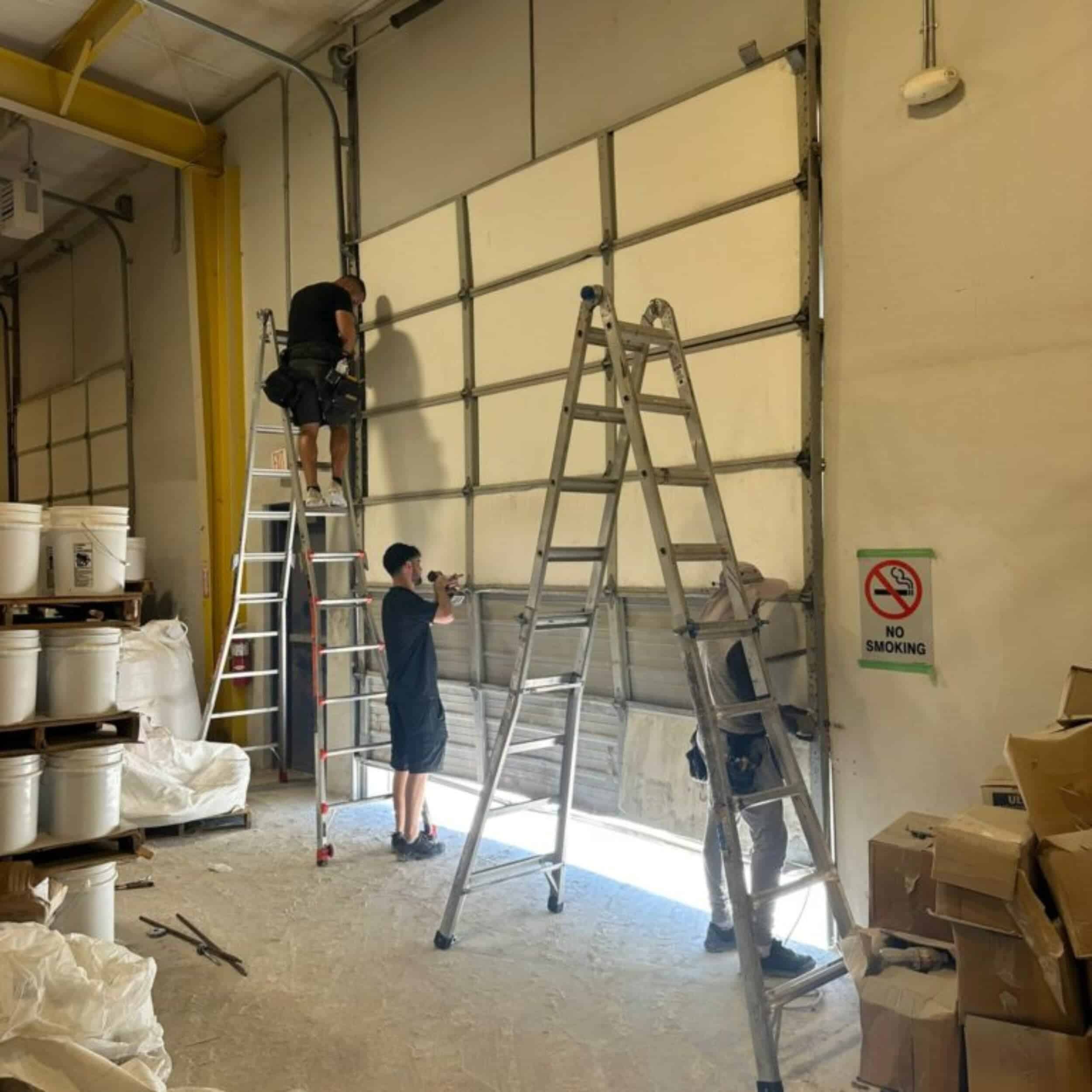 tip top team working on commercial door Tip Top Team Working On Commercial Door